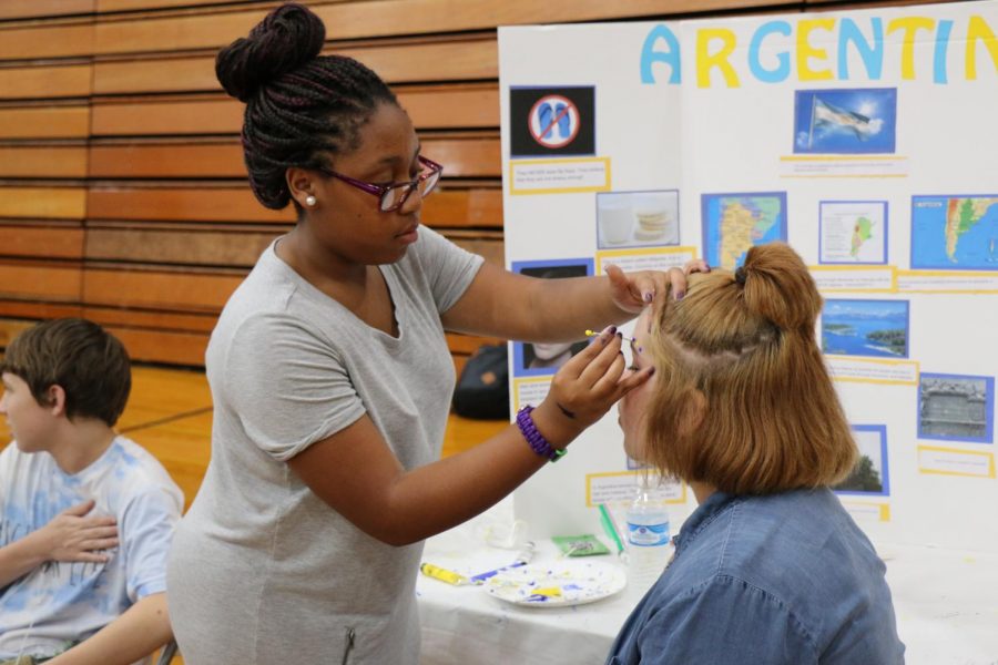 Students+participate+in+face-painting+at+one+of+the+International+Festival+booths.+The+festival+returns+this+year+after+being+canceled+in+2020.+