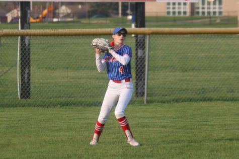 Senior Brooke Hughes makes the catch in the outfield during a home game. 
