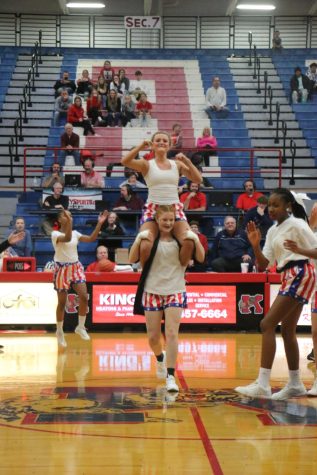 Senior Jillian Braswell performs with senior Karley Trine during the dance teams Fight Night halftime performance.