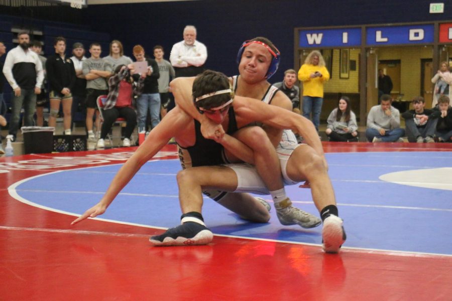 Senior Kyan Gamble tries to take down and pin in opponent in a dual meet at KHS/