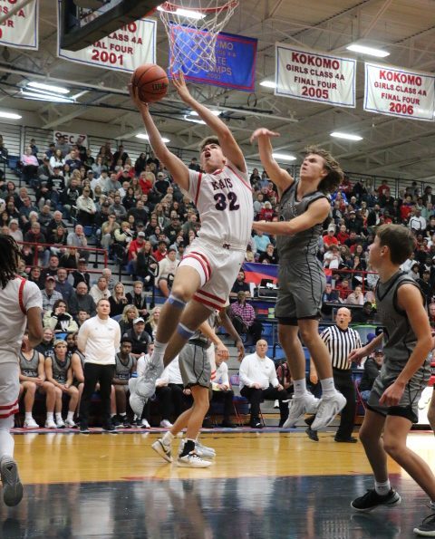 Max Feuerle takes the ball to the hoop during the Kats season opener against Western. The Kats mauled the Panthers, 69-22.