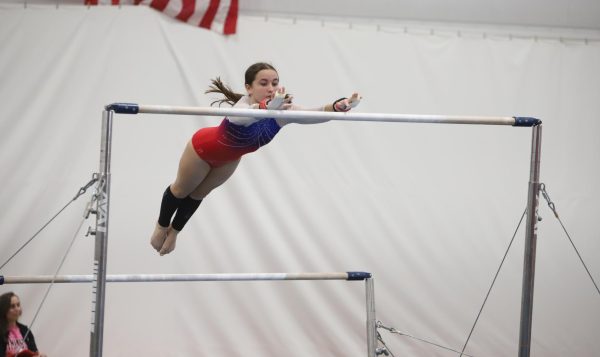Sophomore Megan Leavitt competes on the uneven bars at the 2024 North Central Conference meet. Leavitt earned all-conference honors at the meet. 