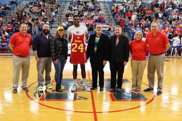 Senior Flory Bidunga is presented his McDonalds All-American jersey during senior night at Memorial Gym. Bidunga, who will play at Kansas next year, is the first KHS player to be named to the All-American team. 