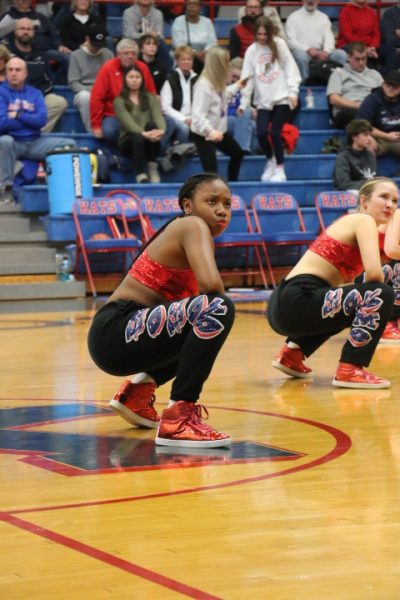 Senior Dede McClung performs with the dance team during halftime of a home basketball game. The dance team placed 5th in both jazz and hip hop at state. 