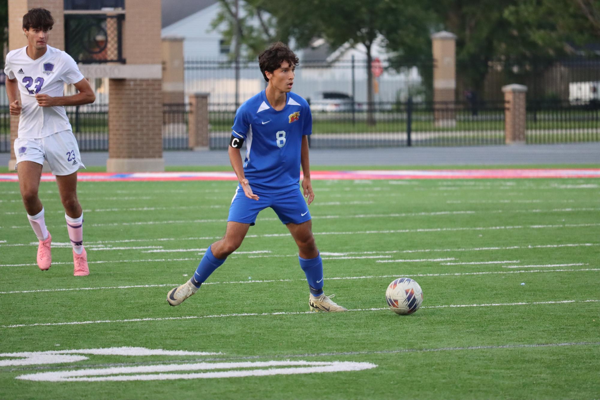 Senior boys' soccer captain Ben Herrera looks for a teammate to pass the ball to during a game against Northwestern. The Kats beat the Tigers 5-2. They host Oak Hill at 12:30pm tomorrow.