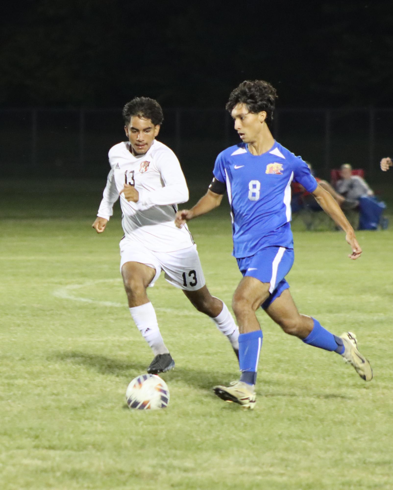 Senior Ben Herrera dribbles the ball down the field during the Kats' senior night game against Lafayette Jeff. The Kats' defeated the Bronchos 3-2.