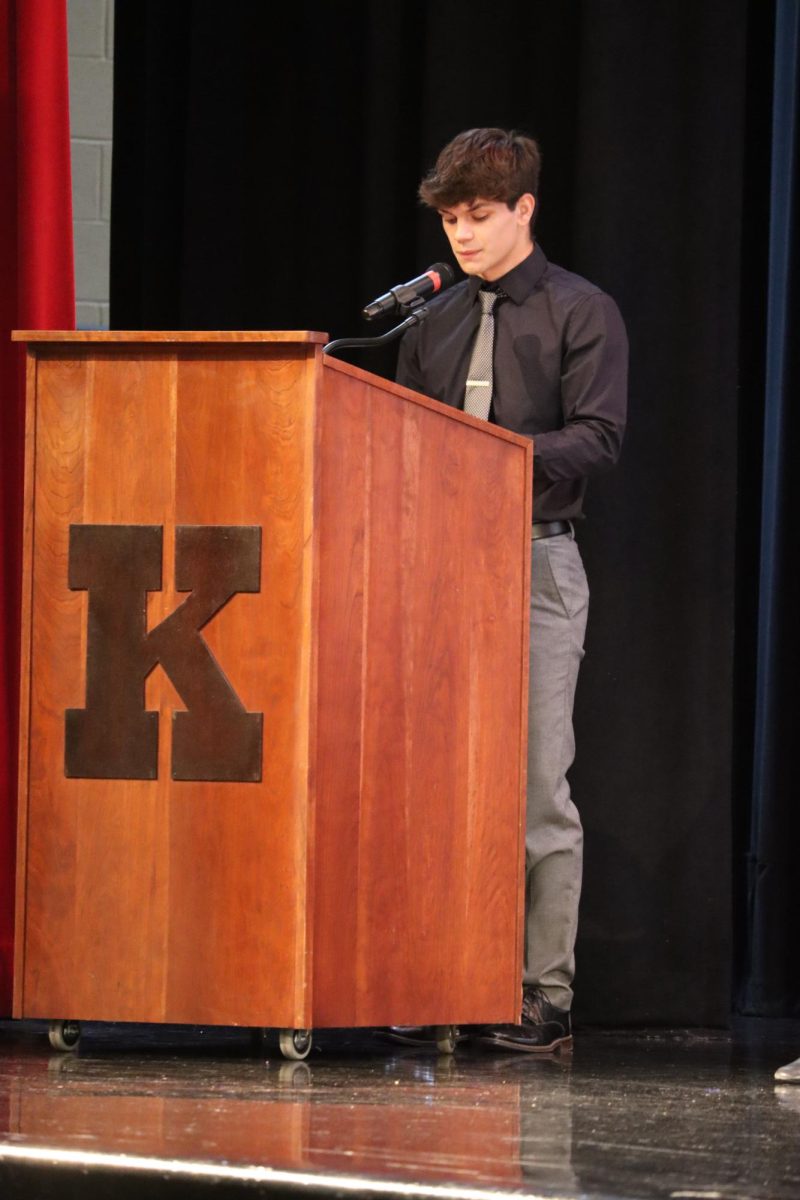 National Honor Society president Gabe Newland welcomes the NHS inductees and audience members to the 2024 ceremony. 