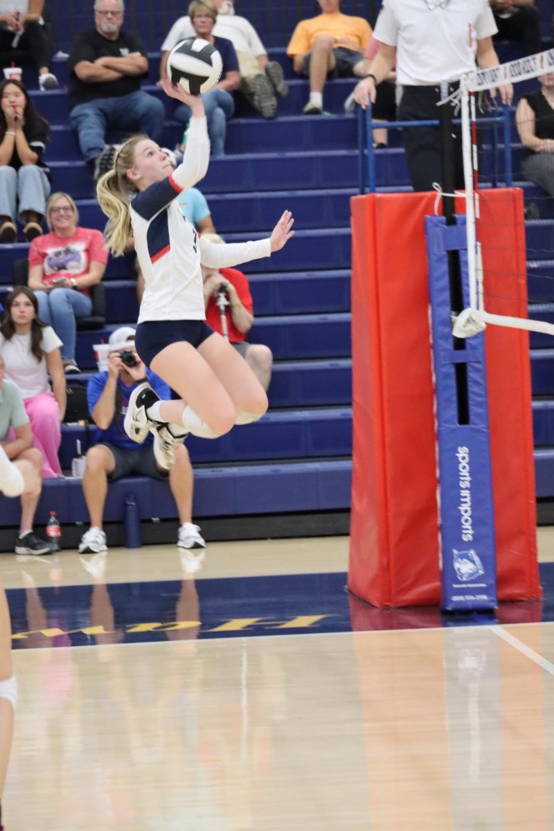 Senior Regan McClain send the ball over the net during a match against Lewis Cass. McClain and the VolleyKats host Harrison tomorrow for senior night. 