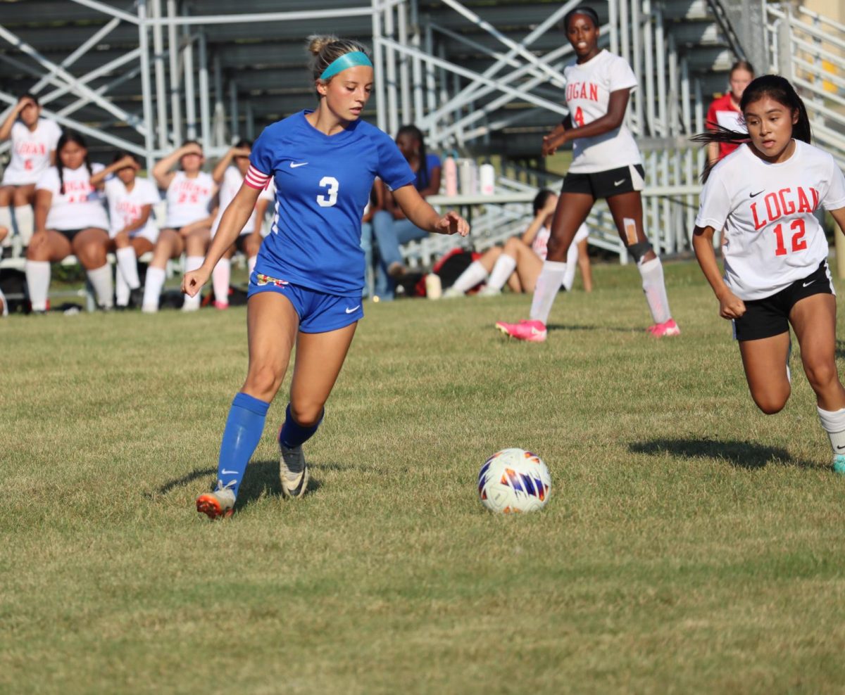 Senior captain Iris Brehm dribbles the ball down the field in a game against the Logansport Berries. The LadyKats defeated the Lady Berries, 2-0. 