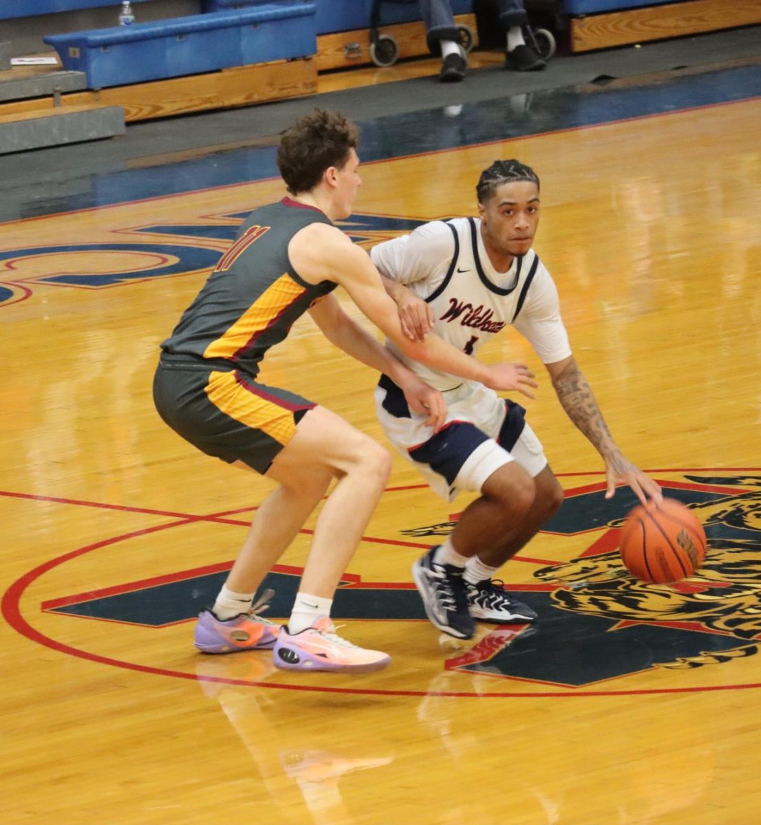 Senior Zion Bellamy brings the ball down the court during last Friday's game against McCutcheon. The Kats beat the Mavs and have had their best start to the season since 2012-13.