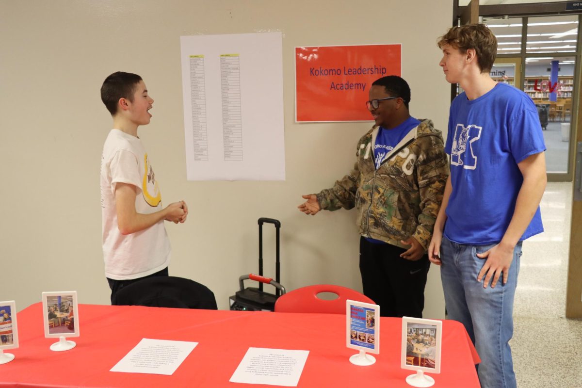 KLA members Hayden Cummins, Tayshawn Jones and Tyler Anderson set up their table at last year's Wildkat Welcome Night. KHS offers a variety of clubs for students to get involved in. 