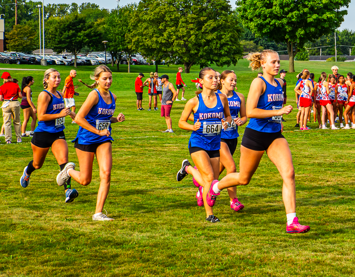 Members of the LadyKat cross country team warm up before the start of a race at Logansport earlier in the season. The girls' and boys' teams travel to Culver tomorrow.
