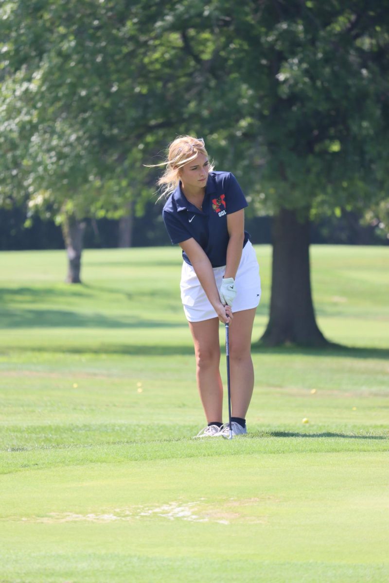 Junior Mia Drake warms up before a home golf match. Drake and the LadyKat golfers won the sectional last Friday, coming in 12 strokes ahead of their opponents. 